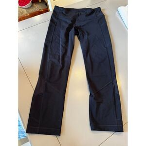 Black lululemon leggings size 6 sheer inset zipper back pocket
